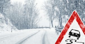 Warning sign on icy road.