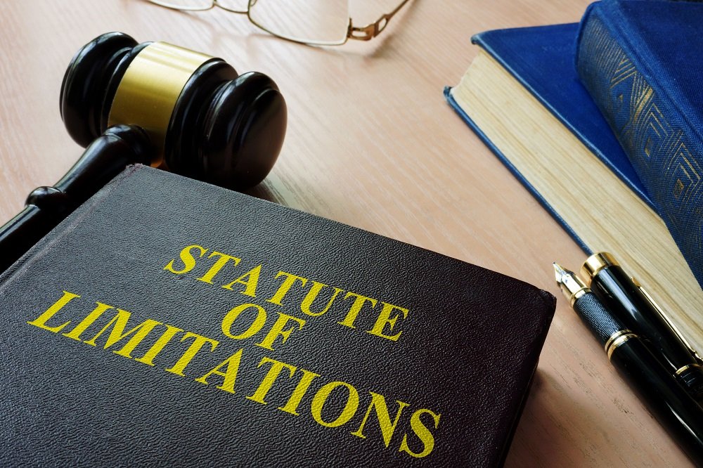 Statute of limitation book with gavel on the side.