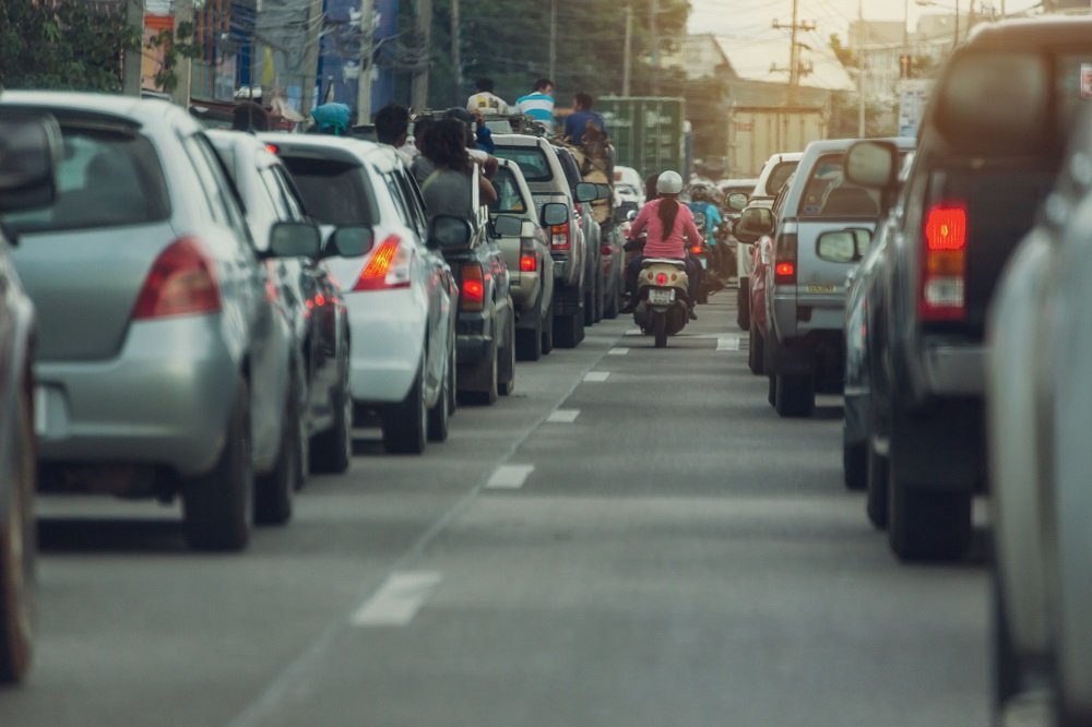 a motorcycle drives between two lanes