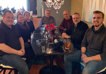 Truitt LAw team gathered around conference table