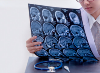 doctor examining brain scans