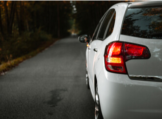 rear view of a car about to make a left turn