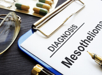 Mesothelioma diagnosis on a clipboard, and drugs for mesothelioma