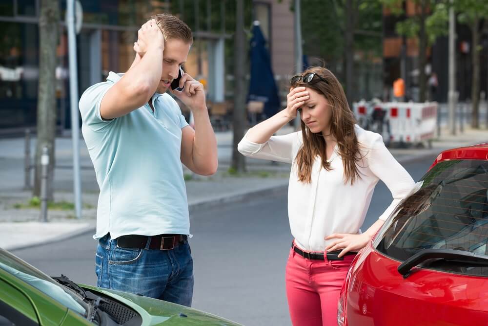 Problematic drivers calling police to report accident in the road.