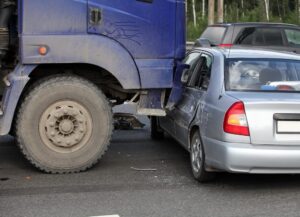 Truck vs car collision in an intersection.