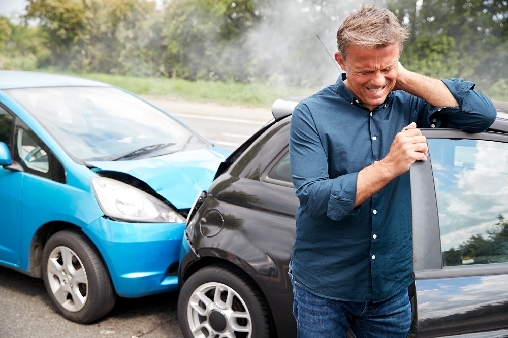 Driver feeling neck pain from rear-end collision.