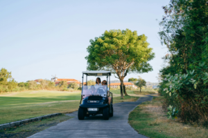 people riding in a golf cart