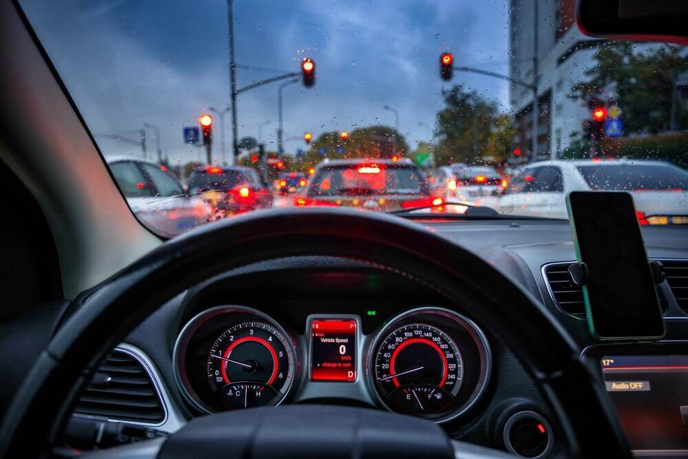 Drivers view stuck on red traffic light.